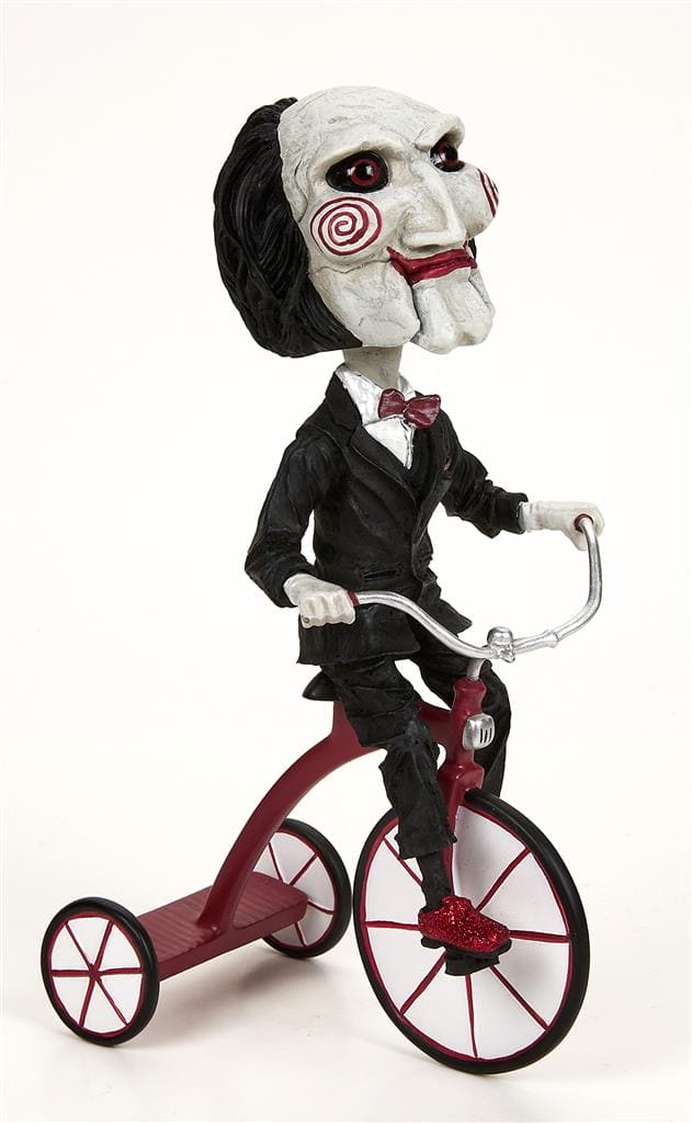 Saw – Puppet on Tricycle (Head Knocker) –